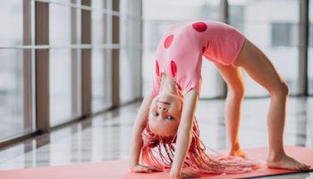 cute-little-girl-doing-gymnastics-mat